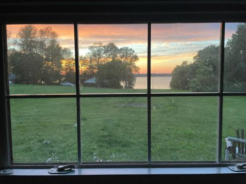 a view of a field from a window at St Lawrence River Retreat in Ogdensburg