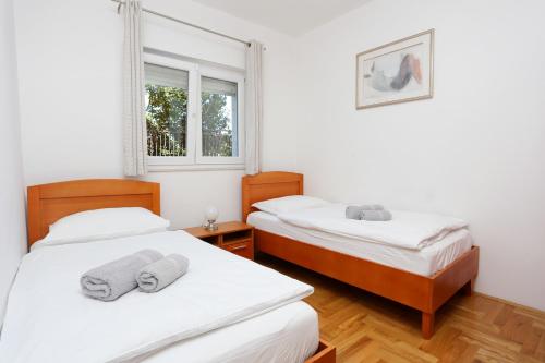 Postel nebo postele na pokoji v ubytování Apartments and rooms with parking space Split - 11623