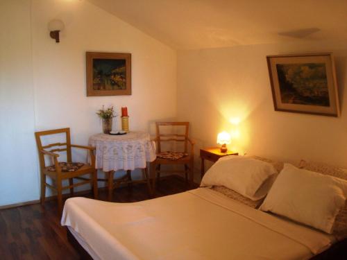 Postel nebo postele na pokoji v ubytování Apartment Krk 11646a