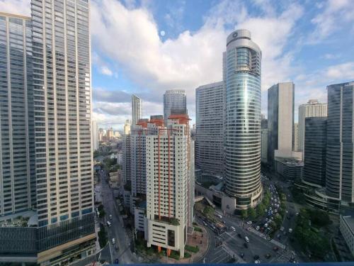 a view of a city with tall buildings at Great View 1 BR Condo in Makati near Trident Tower in Manila