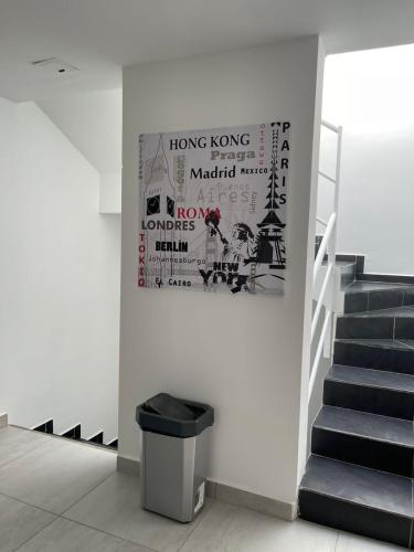a hallway with a staircase and a picture on the wall at Ingenio Park 83 - Apartahotel in Cali