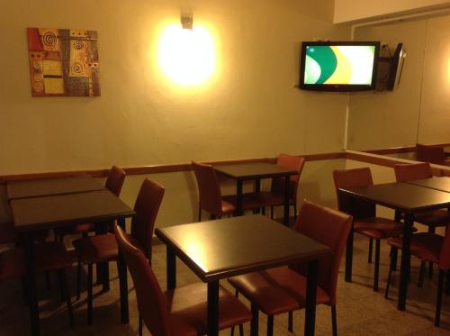 TV a/nebo společenská místnost v ubytování Hotel Mitre