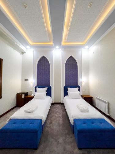 Katil atau katil-katil dalam bilik di Hotel Marakanda
