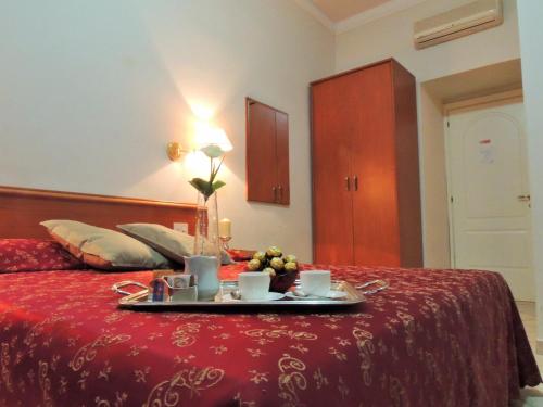 Ein Bett oder Betten in einem Zimmer der Unterkunft Florida rooms - comfort Hotel
