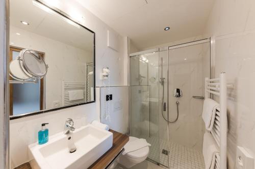Koupelna v ubytování Hotel Mandelhof