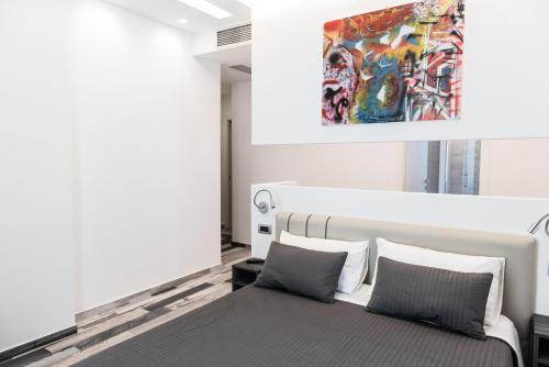 Postel nebo postele na pokoji v ubytování Palazzo IrMa - Hotel - B&B Luxury