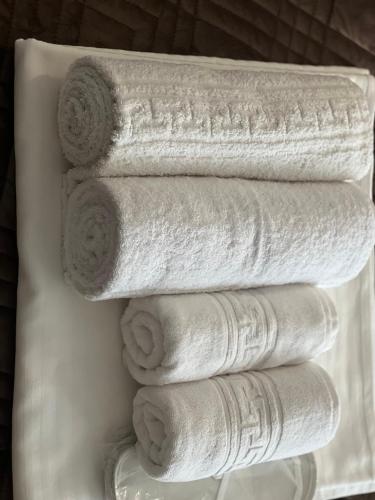 a stack of white towels on a white plate at Kharkovlux in Kharkiv