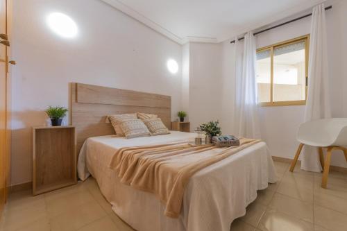 Postel nebo postele na pokoji v ubytování Apartamento con piscina a 250m de la playa