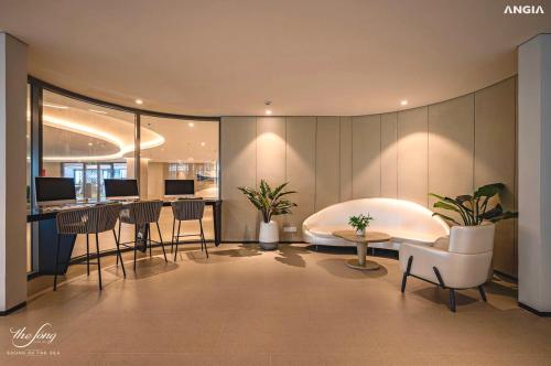 Ένα ή περισσότερα κρεβάτια σε δωμάτιο στο Milan Homestay - The Song Vung Tau Apartment