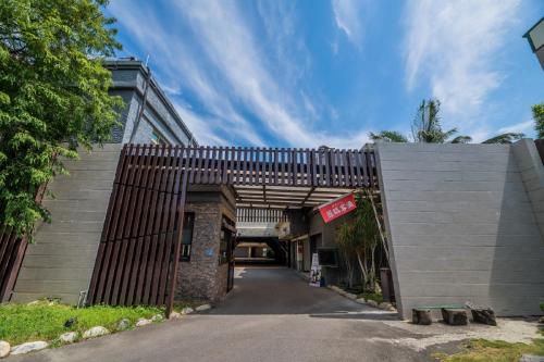 an entrance to a building with a wooden gate at Region Motel in Lugang