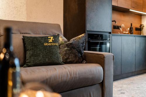 a couch with a pillow on it in a kitchen at Sibenbras Natural Aparthotel in Limone sul Garda