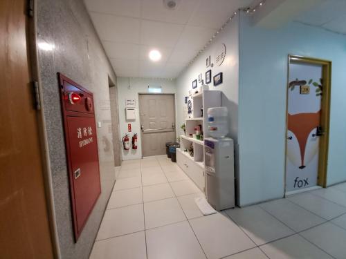 a hallway of a hospital with a refrigerator at Ming House in Yongkang