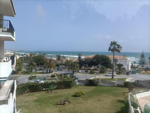 a view of the ocean from the balcony of a house at "La Cala de Mijas Bright Apartment with Sea Views Near the Beach" in La Cala de Mijas
