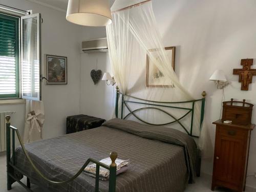Кровать или кровати в номере Casa vacanze dispensa San Pietro