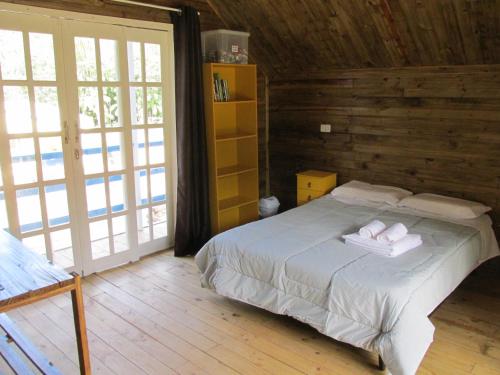 Postel nebo postele na pokoji v ubytování Refúgio dos Valdenses