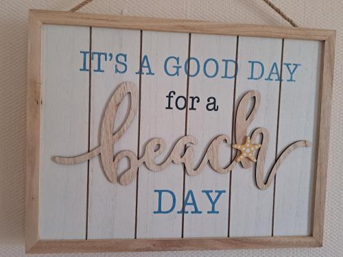 a sign that reads it is a good day for a day at Beside the Sea Chalet, Mablethorpe in Mablethorpe