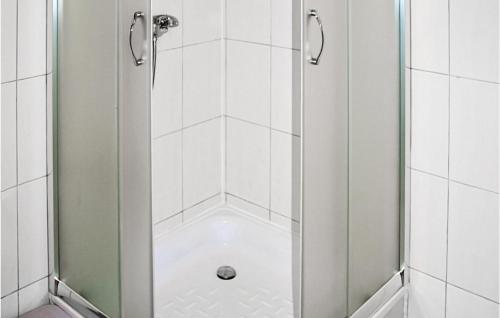 a shower with a glass door in a bathroom at Amazing Home In Kopalino With 2 Bedrooms And Wifi in Kopalino
