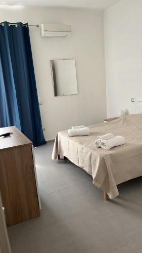 a hospital room with two beds and a mirror at Le zagare in Palagiano