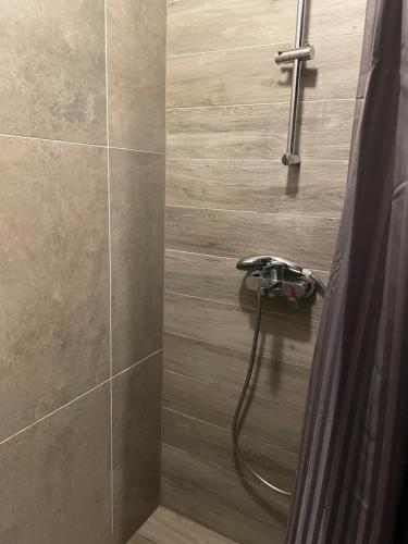 a shower with a faucet in a bathroom at Chalet FiMiLi in Vyšná Boca