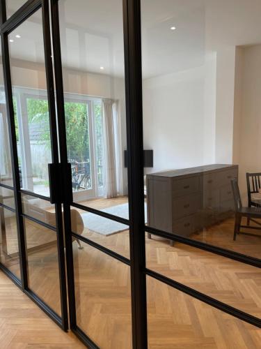 a living room with a sliding glass door at Canal House in Historic City Center Gouda in Gouda