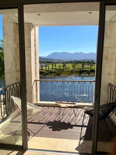 a balcony with a bench and a view of the water at Luxueux appartement Ritz Carlton Marina Smir in Sania Torres