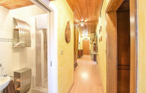 a hallway leading to a bathroom with a sink at Nice Apartment In Racines-ratschings With Wifi in Stanghe