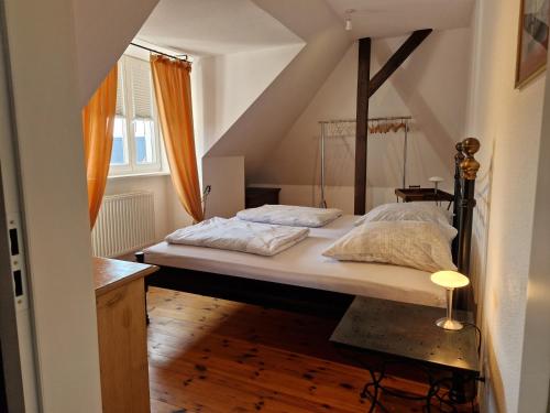 a bedroom with a large bed in a attic at Ferienwohnung mit Flair in Dresden