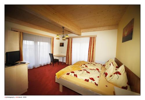Katil atau katil-katil dalam bilik di Hotel Garni Zerza