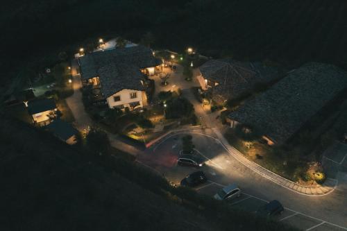 an aerial view of a house at night with lights at Country House Il Cascinale in Colonnella