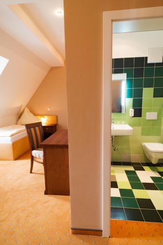 a bathroom with a sink and a toilet in a room at Quartier Rautenstock GbR in Doberlug-Kirchhain