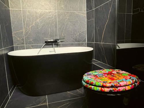 a bathroom with a toilet and a sink at Hôtel les 4 éléments in Palavas-les-Flots