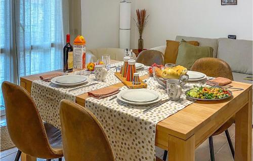 a dining room table with a plate of food on it at Lovely Apartment In Arpiola-Pianturcano in Arpiola