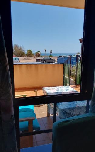 a view of a balcony from a room with a window at Casa Cris in La Lajita
