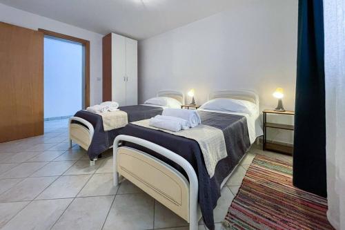 Postel nebo postele na pokoji v ubytování Relax e spazio a due passi dal mare