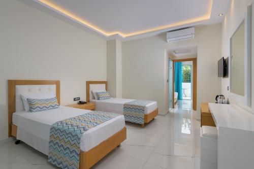 Oceanis Park Hotelにあるベッド