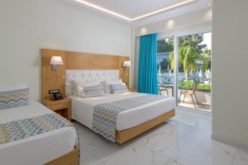 Oceanis Park Hotelにあるベッド