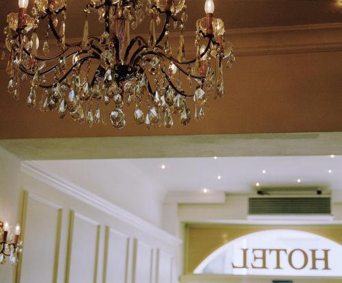 a chandelier is hanging over a store at Hotel Dalberg in Aschaffenburg