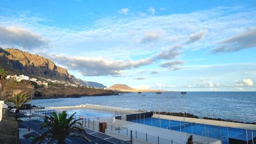 a swimming pool with a view of the ocean at BALCÓN DEL ATLÁNTICO in Garachico