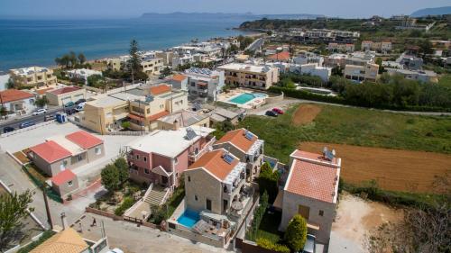 an aerial view of a small town next to the ocean at Villa Constancia in Stalos