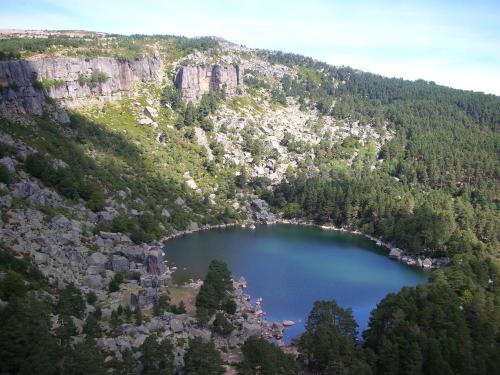 an aerial view of a lake in the mountains at Casa Triskel in Valdeavellano de Ucero