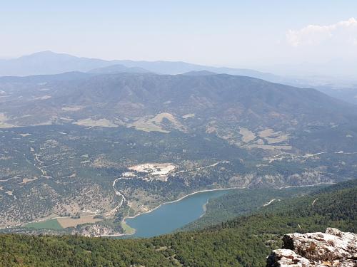 an aerial view of a lake in the mountains at Mondeus Inn Luxury in Deskáti