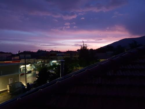 a view of a sunset from the roof of a building at Mondeus Inn Luxury in Deskáti