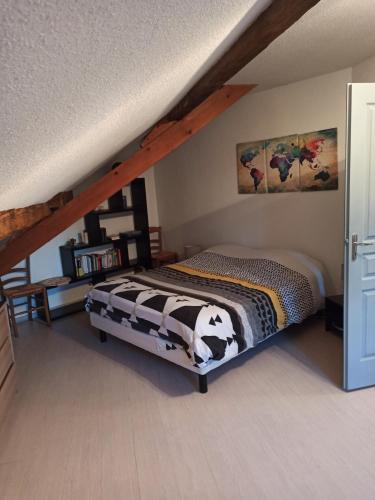 a bedroom with a bed with a cow blanket at la maison de marie in Amblans-et-Velotte