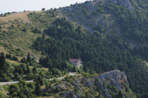 a house on the side of a mountain at Mondeus Inn Luxury in Deskáti