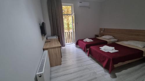Voodi või voodid majutusasutuse Hotel Giorgi toas