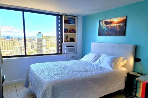 Katil atau katil-katil dalam bilik di Waikiki Condo High Floor Views Beaches Convention Center