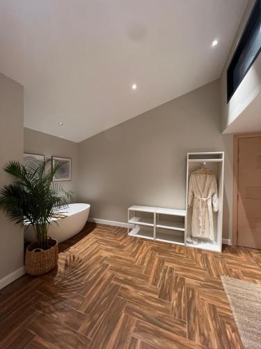 a bathroom with a bath tub and a bath tub at The Hidden Lodge in Al Ain