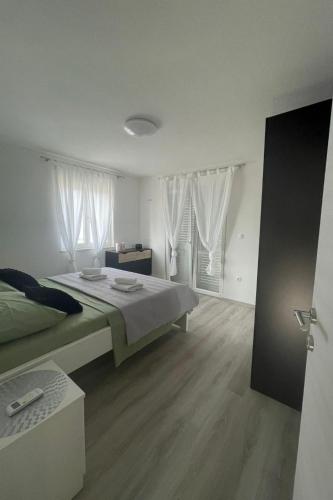 Ліжко або ліжка в номері Villa Ante Škina