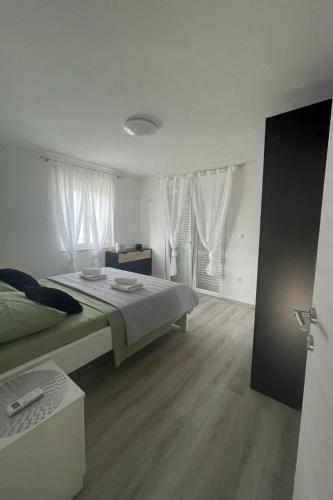 Postel nebo postele na pokoji v ubytování Villa Ante Škina