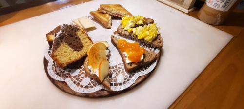 a plate of food with bread and eggs and toast at La Corte dei Cerri, Il Tornio in Spervara